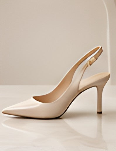 Side view of a DIID champagne slingback heel showing the heel and slingback strap