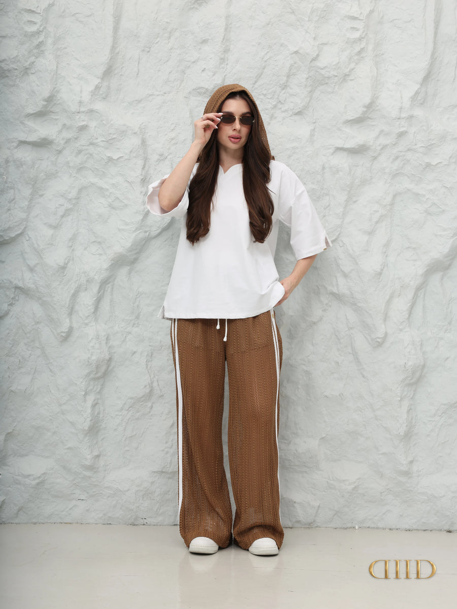 DIID Sable Hood Set: white cotton-spandex top with a brown crochet hood and mocha wide-leg crochet trousers with white side stripes, front view