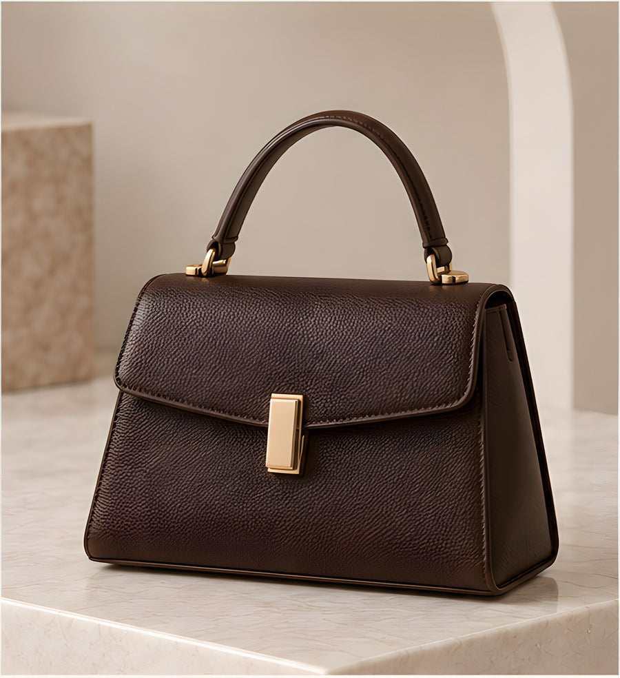 DIID Signature Structured Handbag in chocolate with a gold-tone clasp and top handle, front view